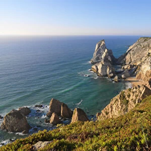 Portugal, Estramadura, Ursa woman sitting on cliff edge (MR)