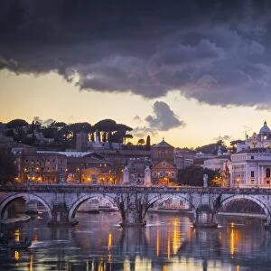 Rome, Lazio, Italy. Sunset on Tevere River, with Saint Peter Cathedral on the background