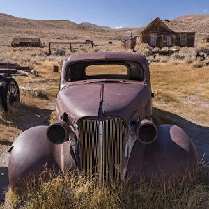 Rusty abandoned old car in Bodie Ghost Town, California, USA. Autumn
