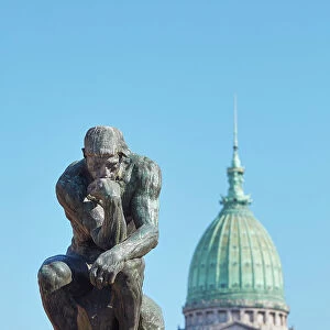 The sculpture of "The Thinker" (Le Penseur) by French artist Auguste Rodin in front of the Argentine National Congress dome, Monserrat, Buenos Aires, Argentina