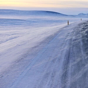 Snow drifts across the main road at Grimsstadir, Iceland