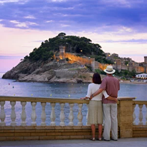 Spain, Catalonia, Costa Brava, Tossa de Mar, man and woman looking at view (MR)
