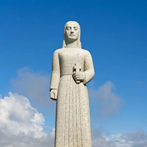 Statue of Landsyn by Gunnfridi Jonsdottur near Strandakirkja church on sunny day, Selvogur, Reykjanes Peninsula, Iceland