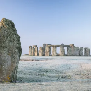 Stonehenge and the Heel Stone at dawn on a chill frosty winter morning, Wiltshire, England