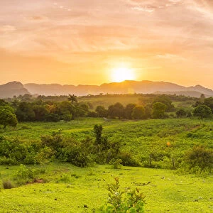 Sunset over the tobacco plantations and limestone hills (Mogotes) of the Vinales