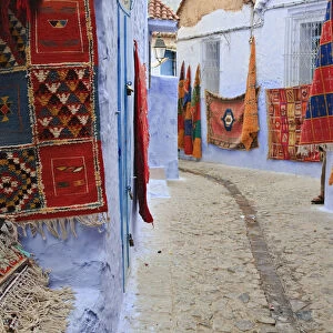 Traditional Moroccan rugs and fabrics on display, Chefchaouen, Morocco