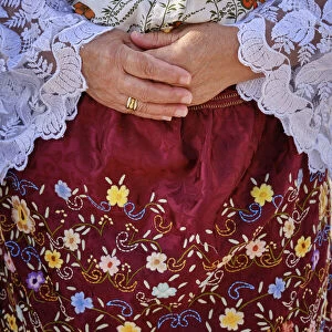 Detail of the traditional outfit used by Nazare women. Colourful dresses with seven skirts. Nazare, Portugal