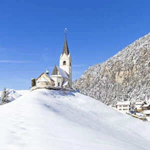 Typical church of Davos Wiesen after a snowfall. Landwasser Valley, Albula Valley