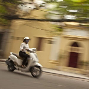 Woman riding a scooter (Moto), Old Quarter, Hanoi, Vietnam