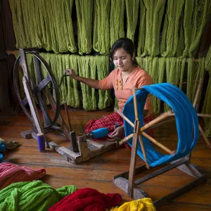 Woman winding up thread at weaving workshop on Lake Inle, Nyaungshwe Township