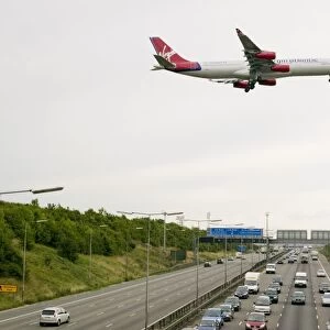 traffic congestion on the M1 motorway at Loughborough due to sheer volume of traffic with a plane coming into land at East Midlands