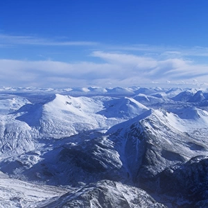 The view of the Mamore mountains from the summit of Ben Nevis in winter, Scotland, UK
