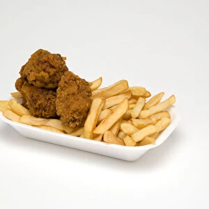 Food, Cooked, Poultry, Battered chicken wings with potato chips in a polystyrene foam