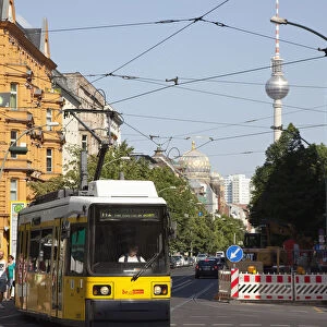 Germany, Berlin, Mitte, tram exiting Oranienburger Strasse with the Neue Synagogue