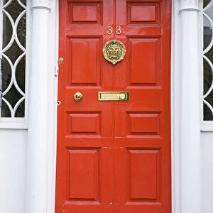 Red door in Georgian doorway