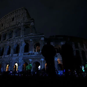 The ancient Colosseum is seen after the lights were switched off for Earth Hour in Rome