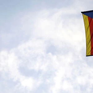 A Catalan separatist flag with a black ribbon hangs from a balcony in Barcelona