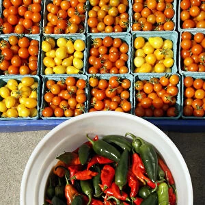 Cherry tomatoes and hot peppers are displayed for sale at the Food Projects Farmer s