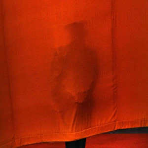 A Chinese soldier stands against curtain before official welcoming ceremony for British