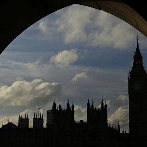 The Houses of Parliament and Big Ben are silhouetted against the sky in London