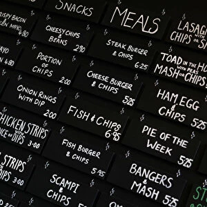 The menu board is seen inside the Little Driver pub in east London