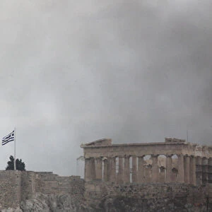 The Parthenon surrounded by smoke in Athens