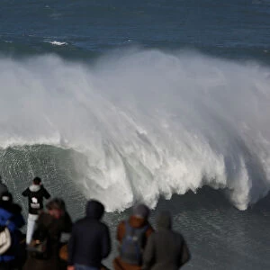 People gather to watch the Nazare Challenge championship at Praia do Norte in Nazare