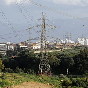 Power lines connecting pylons of high-tension electricity are seen in Algiers