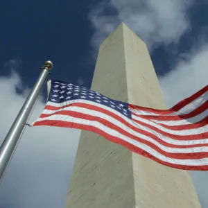 WASHINGTON MONUMENT WITH AMERICAN FLAG