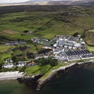 Aerial view of coastline with maltings and town, Port Ellen Distillery, Port Ellen, Isle of Islay, Inner Hebrides