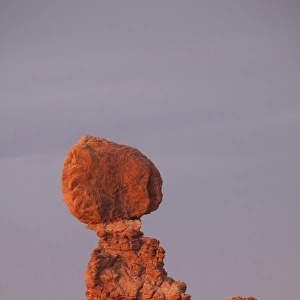 Balanced Rock in the glow of evening light is a defiant 55-foot tall block of Estrada Sandstone that rests on a narrow
