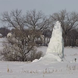 Ice formed at leaking water well in freezing temperatures, North Dakota, U. S. A. february