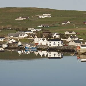 View of coastal village reflected in sea, Aith, Aith Voe, Mainland, Shetland Islands, Scotland, May