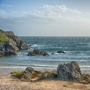 View of rocky beach and choppy sea, Porth Dafarch, Holyhead, Holy Island, Anglesey, Wales, August
