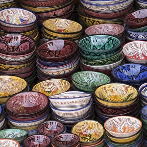 Africa, Morocco, Marrakech. Colorfully painted ceramic bowls for sale in a souk, a shop