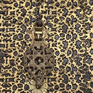 Africa, Morocco. A detail of an ornate brass door and fancy door knocker
