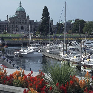 Canada, British Columbia, Victoria Parliament Building, with ships and docks in