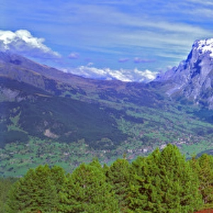 Europe, Switzerland, Grindelwald. Hikers have a beautiful view to Grindelwald