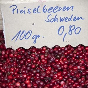 Germany, Bavaria, Passau. Open-air farmers market, red berries from Sweeden