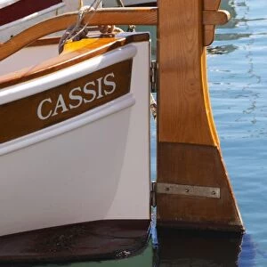 In the harbour in Cassis village. A traditional style boat with wooden rudder marked