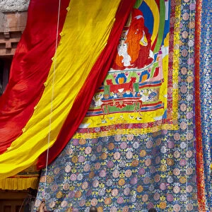 India, Jammu & Kashmir, Ladakh, monks raising the embroidered thangka during the