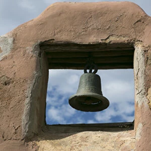 Looking up at a church bell of an adobe building, Taos, New Mexico, USA