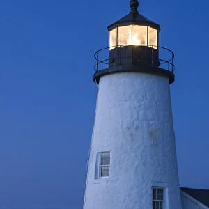 Maine, Pemaquid. Light from the historical lighthouse offers protection to ships