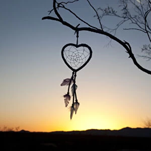 Native American heart shaped dreamcatcher at early morning sunrise