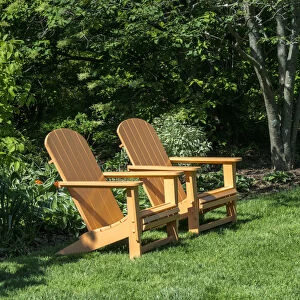 Pair of Adirondack chairs in a garden