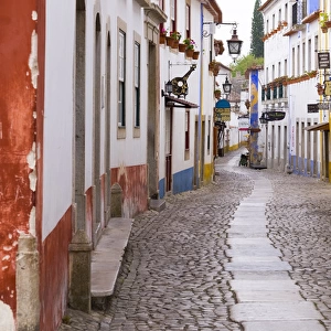 Portugal, Obidos. Leira District. Cobblestone walkways narrow neighborhood streets