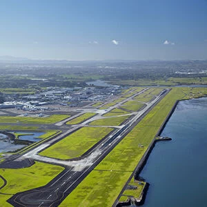Runway at Auckland Airport, and Manukau Harbour, North Island, New Zealand - aerial