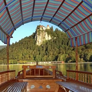 Slovenia, Bled, Lake Bled, pletna boat with view of Bled Castle