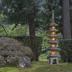 Stone lantern illuminated with candles, Portland Japanese Garden, Oregon