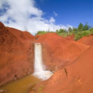 USA, HI, Kauai, Waimea, Waimea Canyon, Small Waterfall in Red Earth